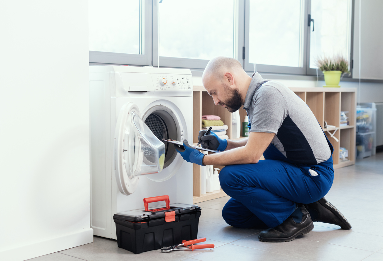 Professional repairman writing an invoice IT specialisms